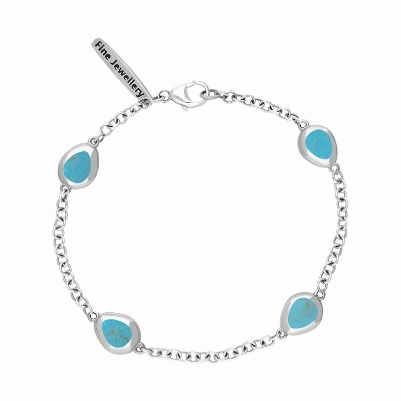 Sterling Silver Turquoise Oval Fleur De Lis Detail Four Stone Bracelet